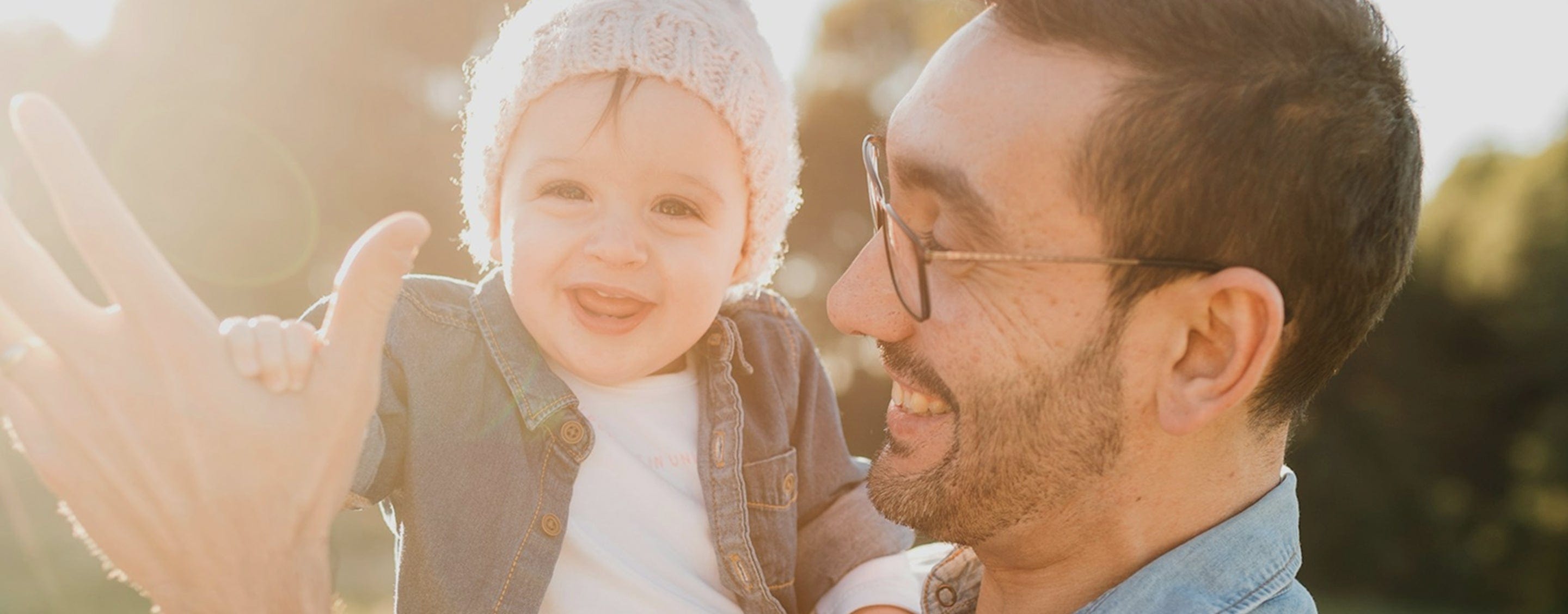 Father and son playing in the sunshine in nature