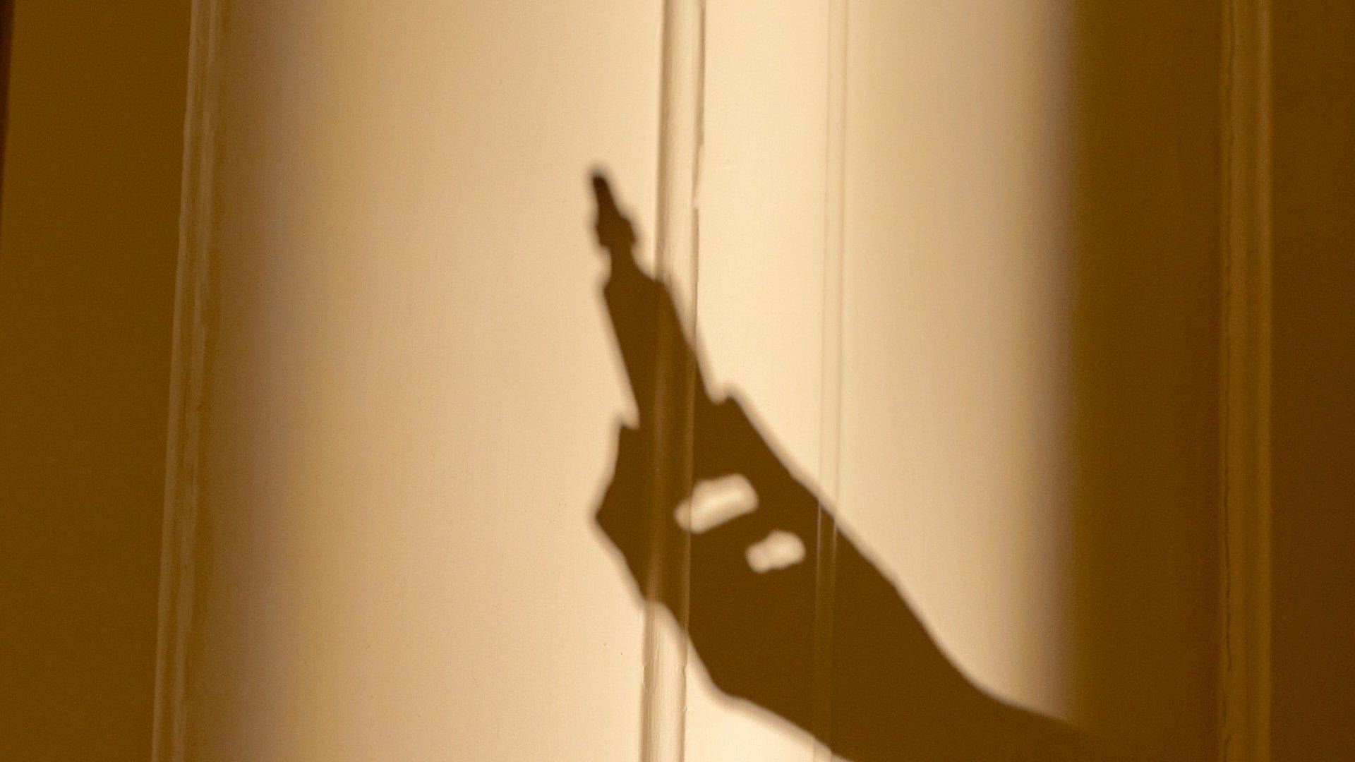 Shadow of Rescue Remedy 20ml Dropper held in outstretched hand