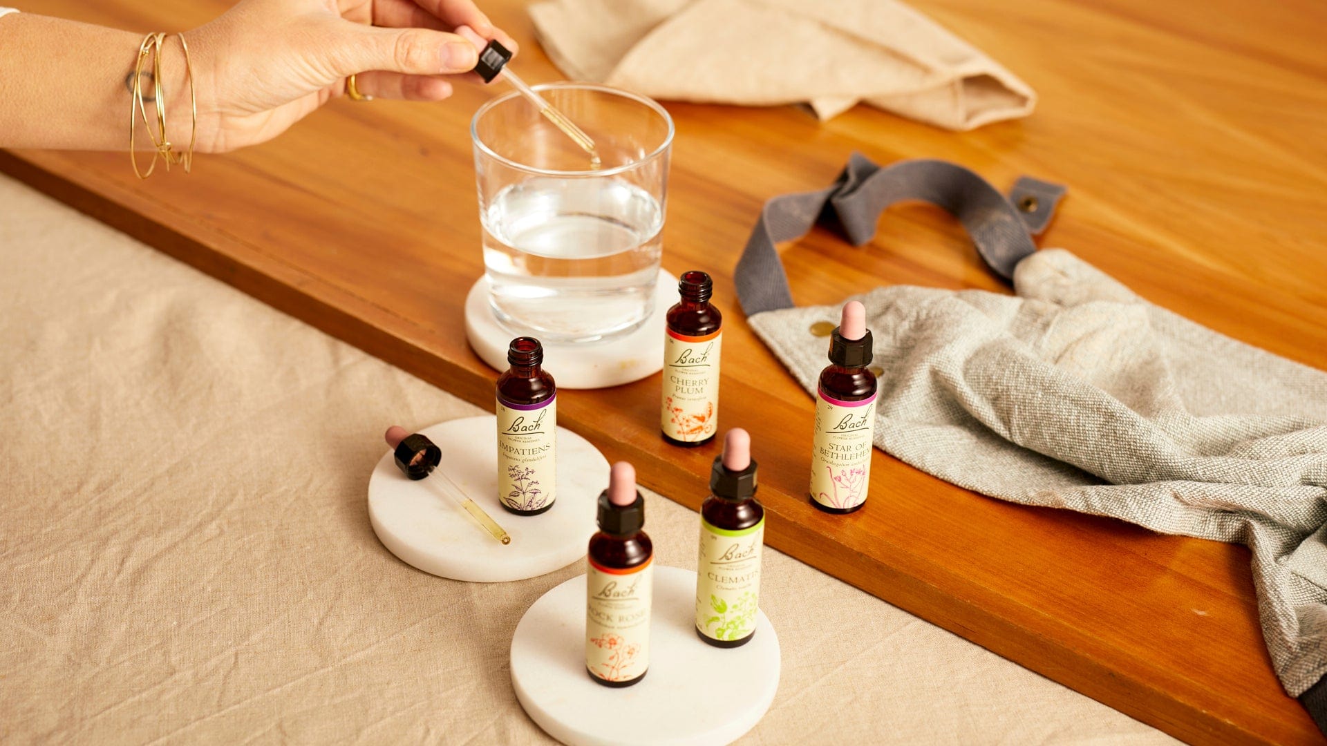 Bach™ Original Flower Remedies Impatiens, Cherry Plum, Star of Bethlehem, Rock Water and Clematis Dropper bottle 20ml into glass of water