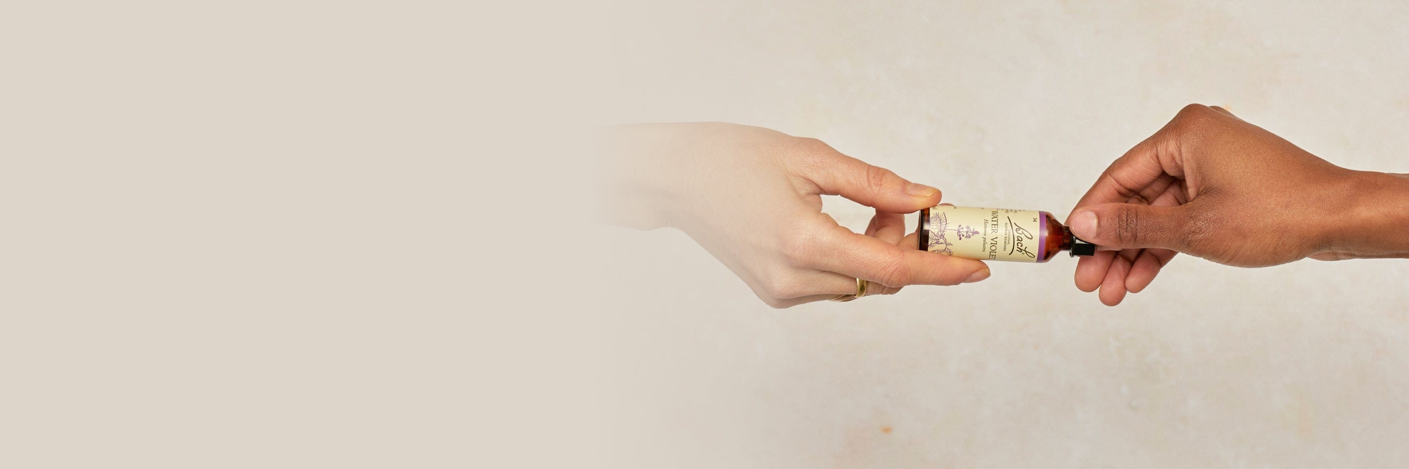 Bach™ Original Flower Remedies Water Violet Dropper passed from hand to hand