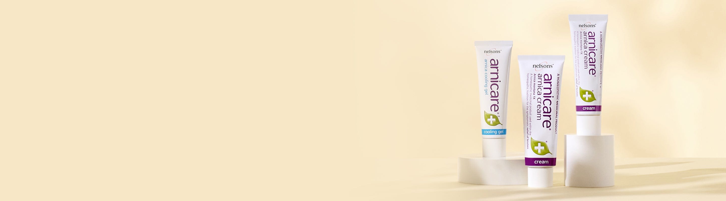 Homeopathic remedies with Arnica Montana plant, Nelsons Arnicare® Cream for bruise relief and Arnicare® Cooling Gel with menthol for muscle soreness