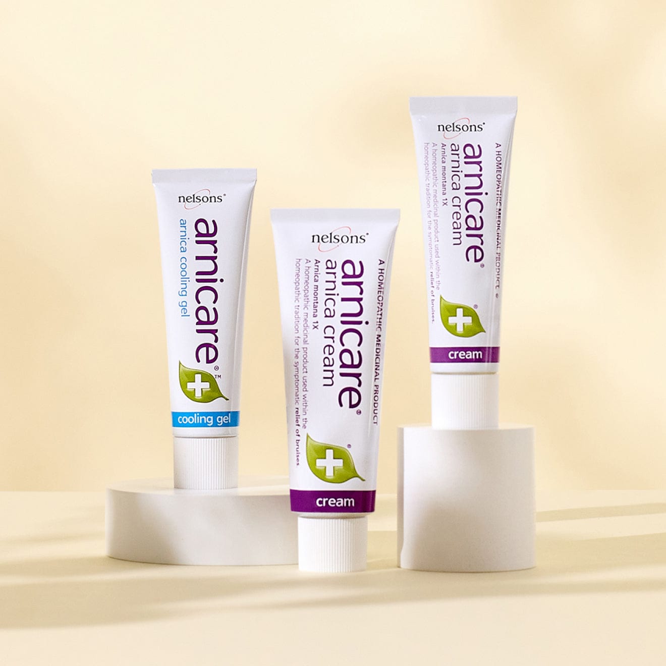 Homeopathic remedies with Arnica Montana plant, Nelsons Arnicare® Cream for bruise relief and Arnicare® Cooling Gel with menthol for muscle soreness