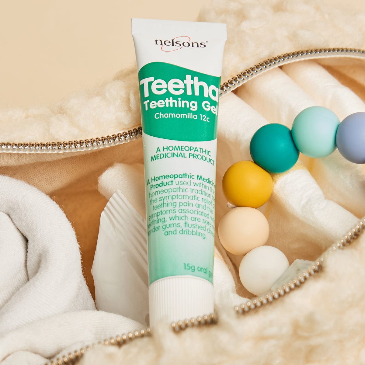 Nelsons Teetha® Teething Gel homeopathic medicinal product in baby changing bag with teething ring