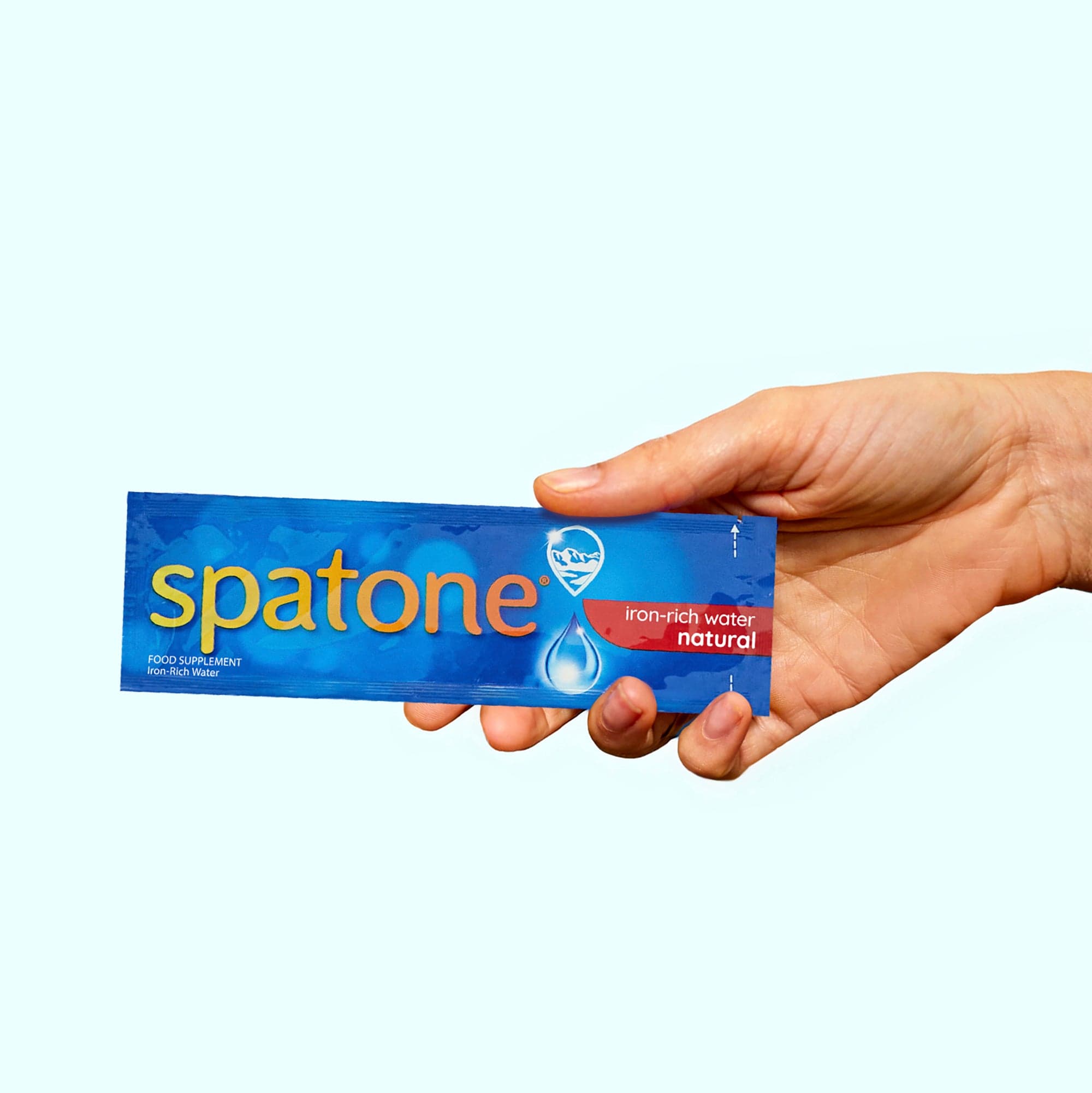 Spatone® Iron-Water natural sachet in hand
