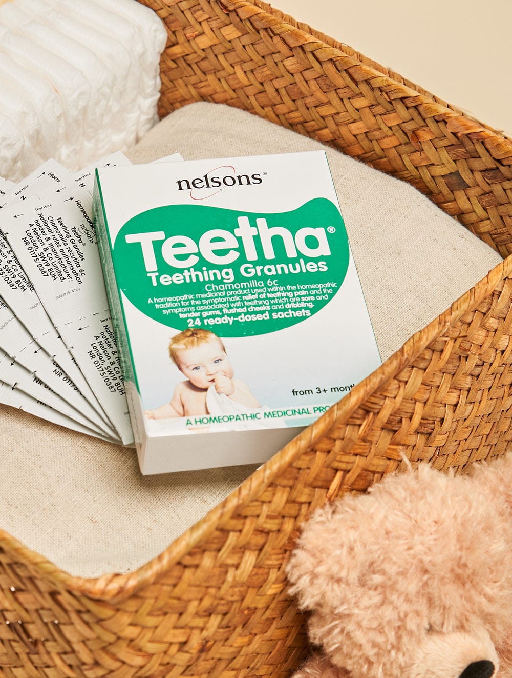 Nelsons Teetha® Granules teething homeopathic remedy 24 read-dosed sachets pack in baby changing basket with teddy bear