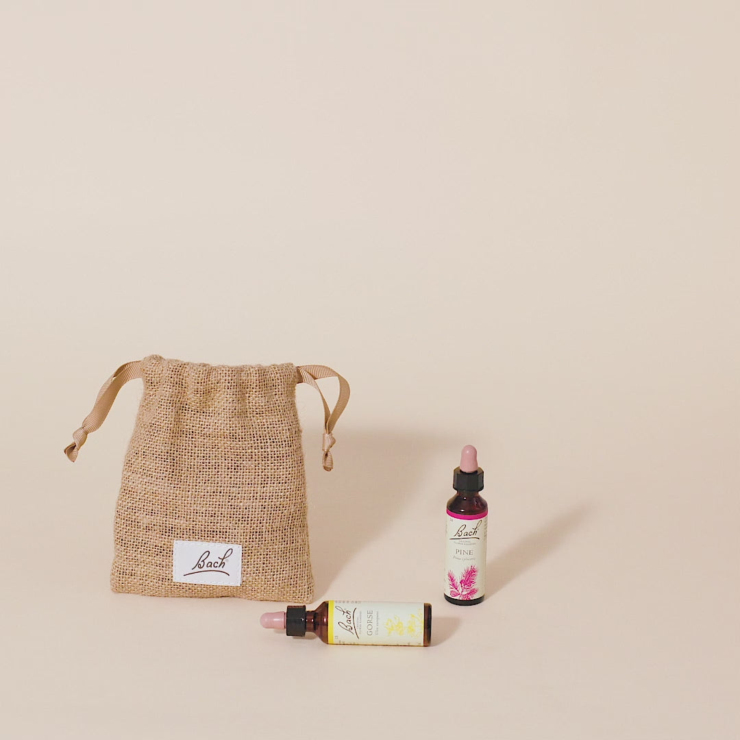 Video of a hand taking out the Bach™ Original Flower Remedy Mustard dropper from the bach bag and placing it next to the Bach™ Original Flower Remedy Pine dropper and Bach™ Original Flower Remedy Gorse dropper which is lying down.