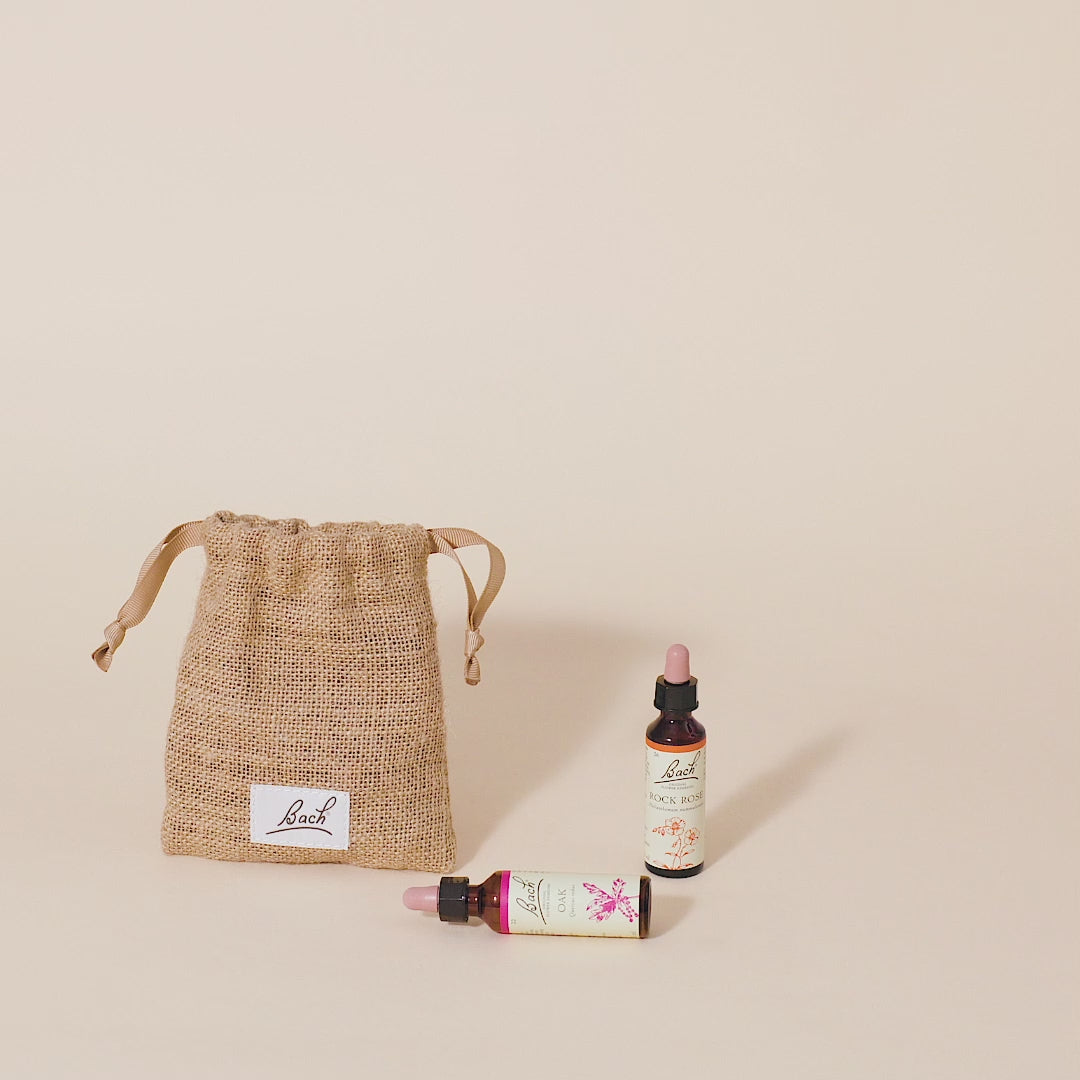 Video of a hand taking out the Bach™ Original Flower Remedy Elm dropper from the bach bag and placing it next to the Bach™ Original Flower Remedy Rock Rose dropper and Bach™ Original Flower Remedy Oak dropper which is lying down.