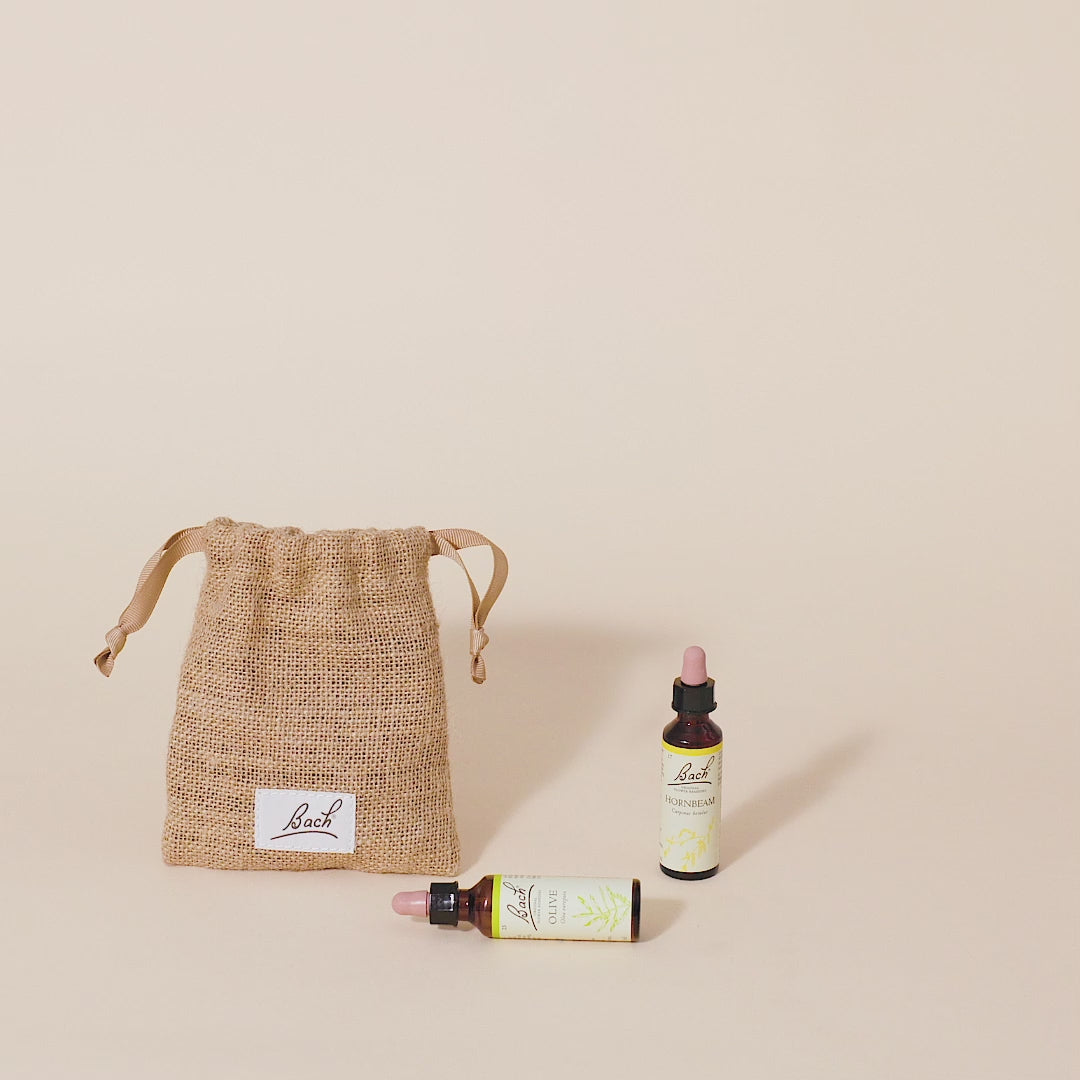 Video of a hand taking out the Bach™ Original Flower Remedy Clematis dropper from the bach bag and placing it next to the Bach™ Original Flower Remedy Hornbeam dropper and Bach™ Original Flower Remedy Olive dropper which is lying down.