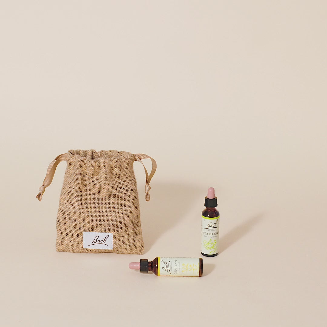 Video of a hand taking out the Bach™ Original Flower Remedy Wild Oat dropper from the bach bag and placing it next to the Bach™ Original Flower Remedy Honeysuckle dropper and Bach™ Original Flower Remedy Gentian dropper which is lying down.