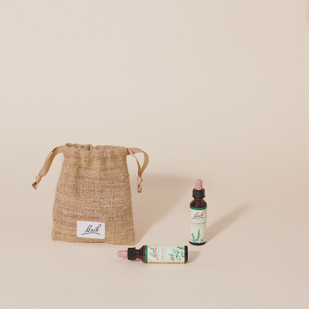 Video of a hand taking out the Bach™ Original Flower Remedy Gorse dropper from the bach bag and placing it next to the Bach™ Original Flower Remedy Agrimony dropper and Bach™ Original Flower Remedy Holly dropper which is lying down.