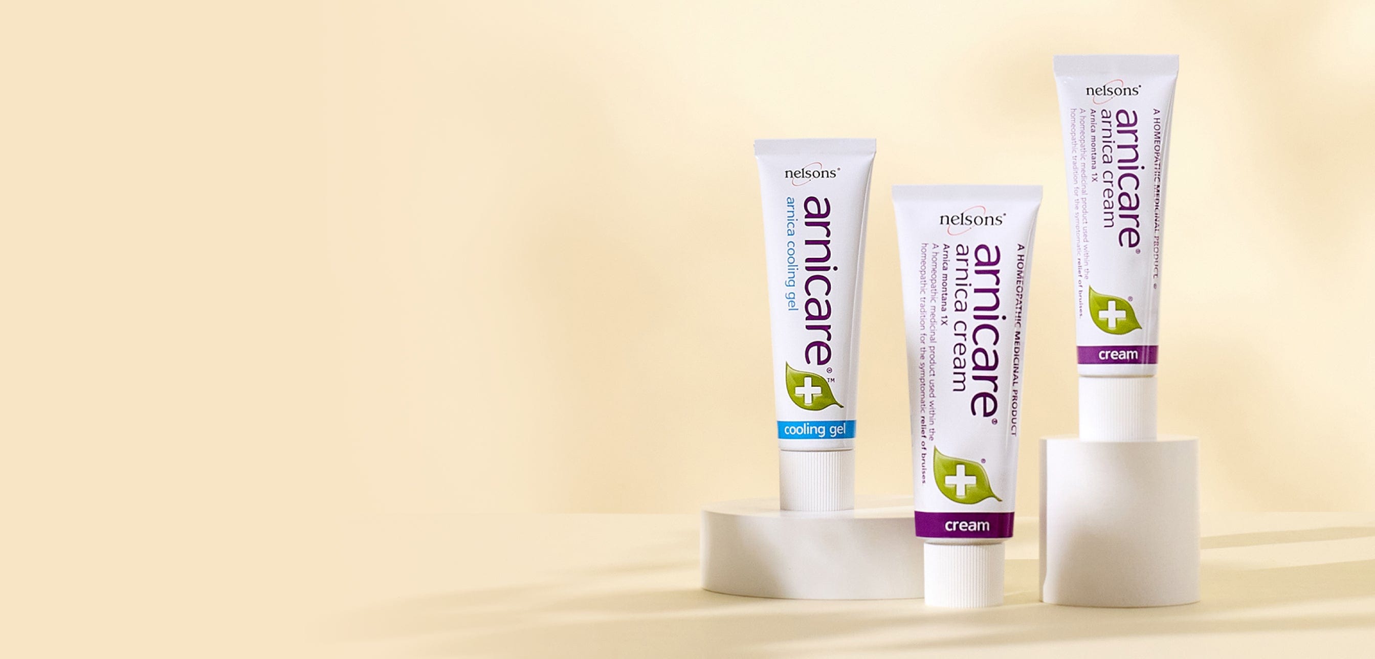 Homeopathic remedies with Arnica Montana plant, Nelsons Arnicare® Cream for bruise relief and Arnicare® Cooling Gel with menthol for muscle soreness